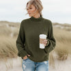 Women’s oversized sweater featuring a cozy turtleneck design, crafted from soft acrylic material, perfect for a boho chic look. Ideal for casual wear 3