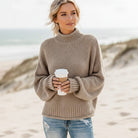 Women’s oversized sweater featuring a cozy turtleneck design, crafted from soft acrylic material, perfect for a boho chic look. Ideal for casual wear 5