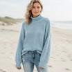 Women’s oversized sweater featuring a cozy turtleneck design, crafted from soft acrylic material, perfect for a boho chic look. Ideal for casual wear 6