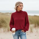 Women’s oversized sweater featuring a cozy turtleneck design, crafted from soft acrylic material, perfect for a boho chic look. Ideal for casual wear 8