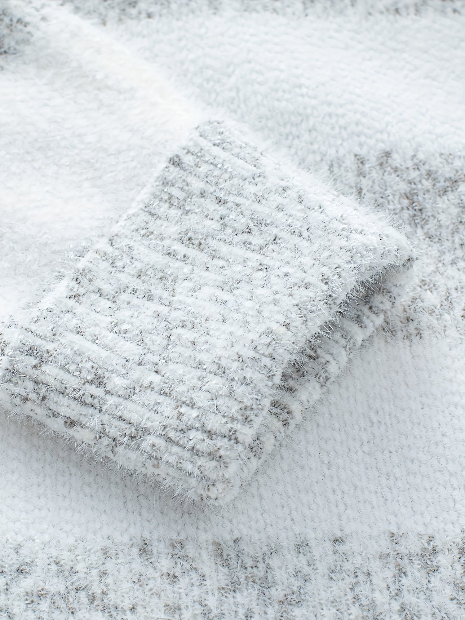Women's oversized sweater in classic grey, featuring a high neckline and cozy knit design, perfect for casual outings and chilly days. 4