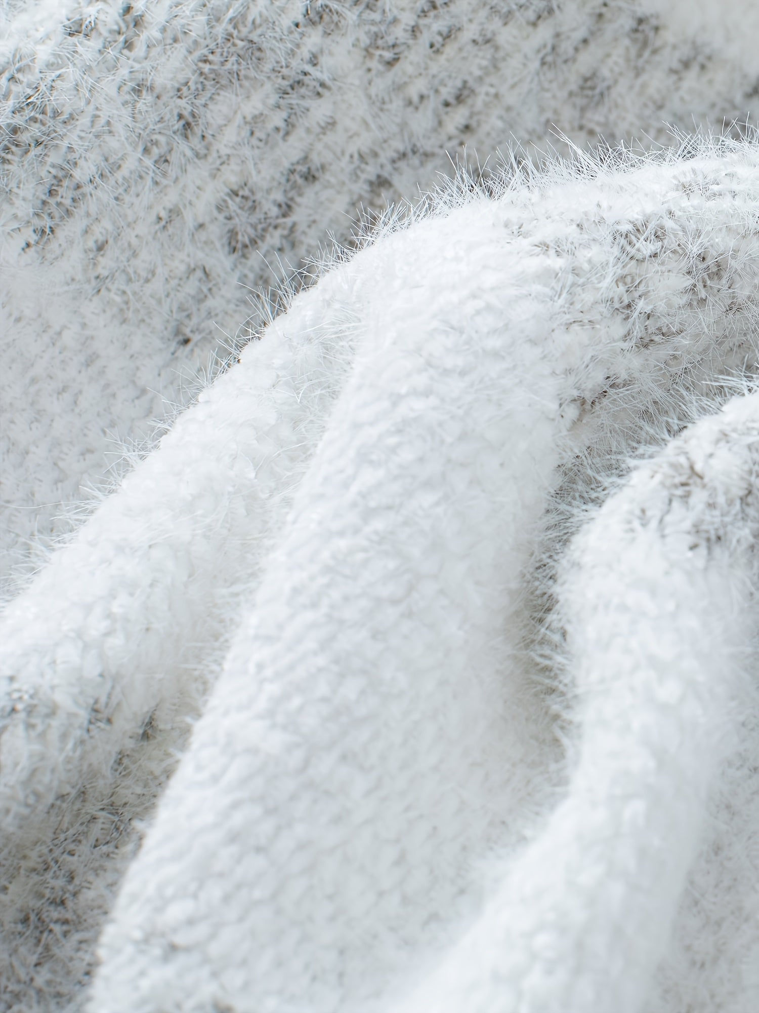 Women's oversized sweater in classic grey, featuring a high neckline and cozy knit design, perfect for casual outings and chilly days. 5