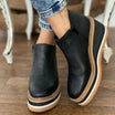 Women's black retro-style platform wedge ankle boots featuring a round toe and convenient side zipper for easy wear, designed for comfort and style. 2