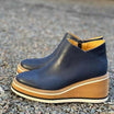 Women's black retro-style platform wedge ankle boots featuring a round toe and convenient side zipper for easy wear, designed for comfort and style. 7