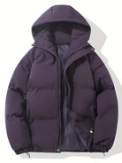 Women's black puffer jacket with hood and zip pockets, featuring a quilted design, suitable for cold weather, available in sizes S-3XL. 2