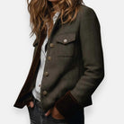 Women's quilted jacket featuring a luxurious velvet trim and elegant gold button detail, designed in a stylish herringbone tweed pattern. 3