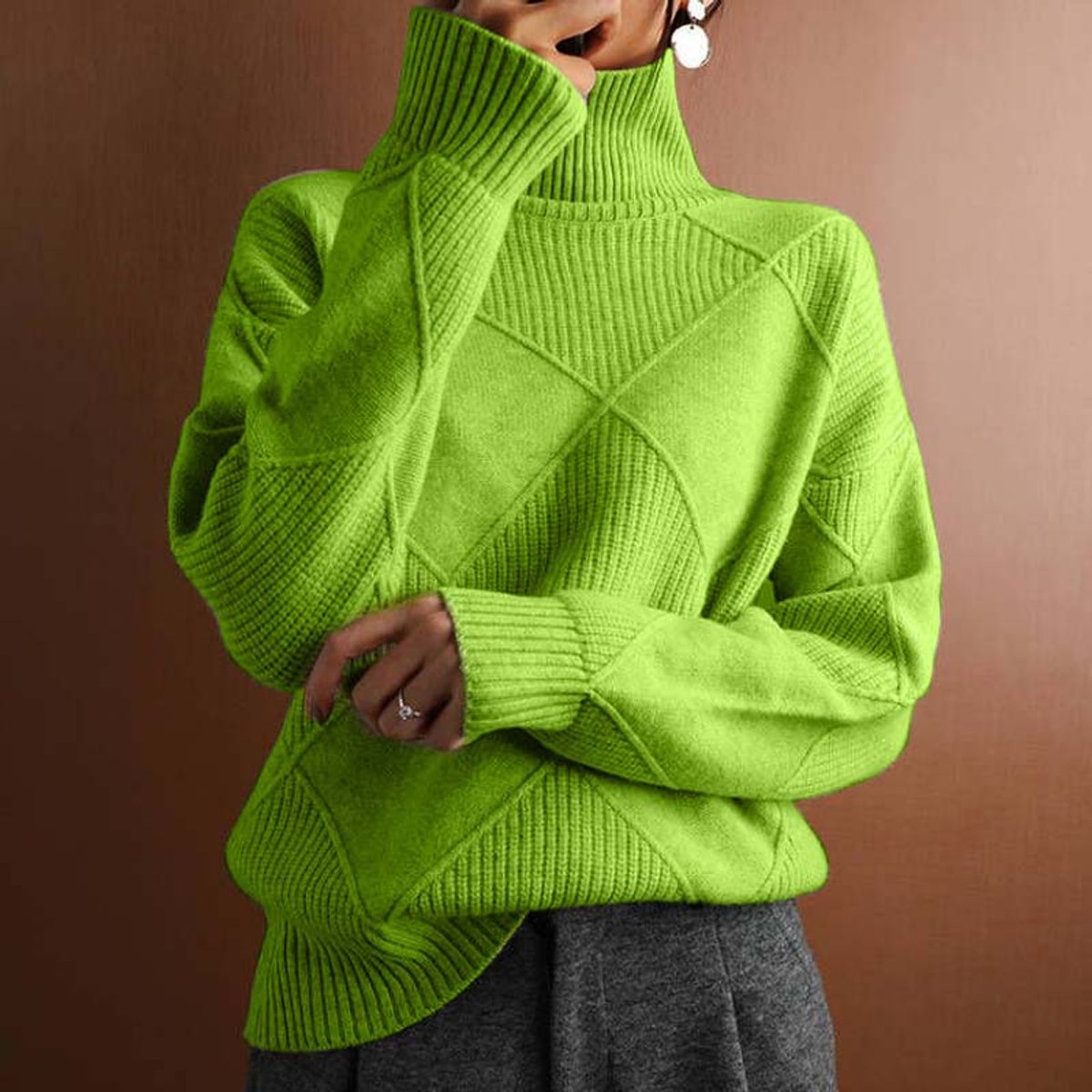 Women's cozy sweater featuring a stylish argyle knit pattern and high ribbed collar, available in multiple colors for a relaxed fit. 0