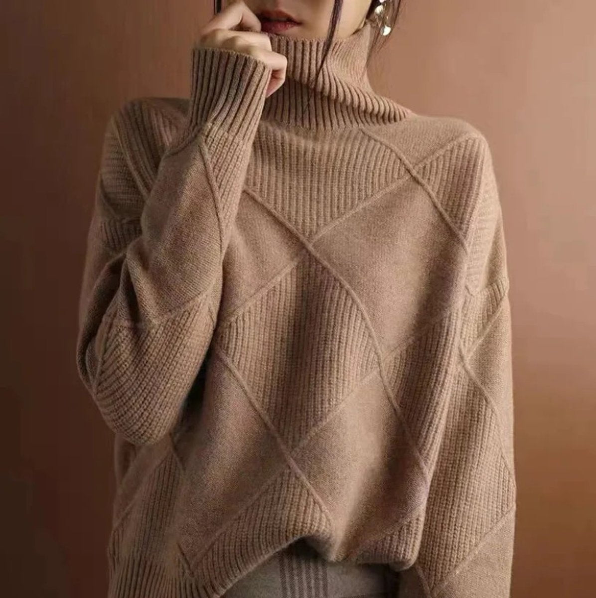 Women's cozy sweater featuring a stylish argyle knit pattern and high ribbed collar, available in multiple colors for a relaxed fit. 12