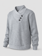 Women's sweater featuring an asymmetric shawl collar and stylish button detail, crafted from soft textured knit for ultimate comfort and warmth. 1