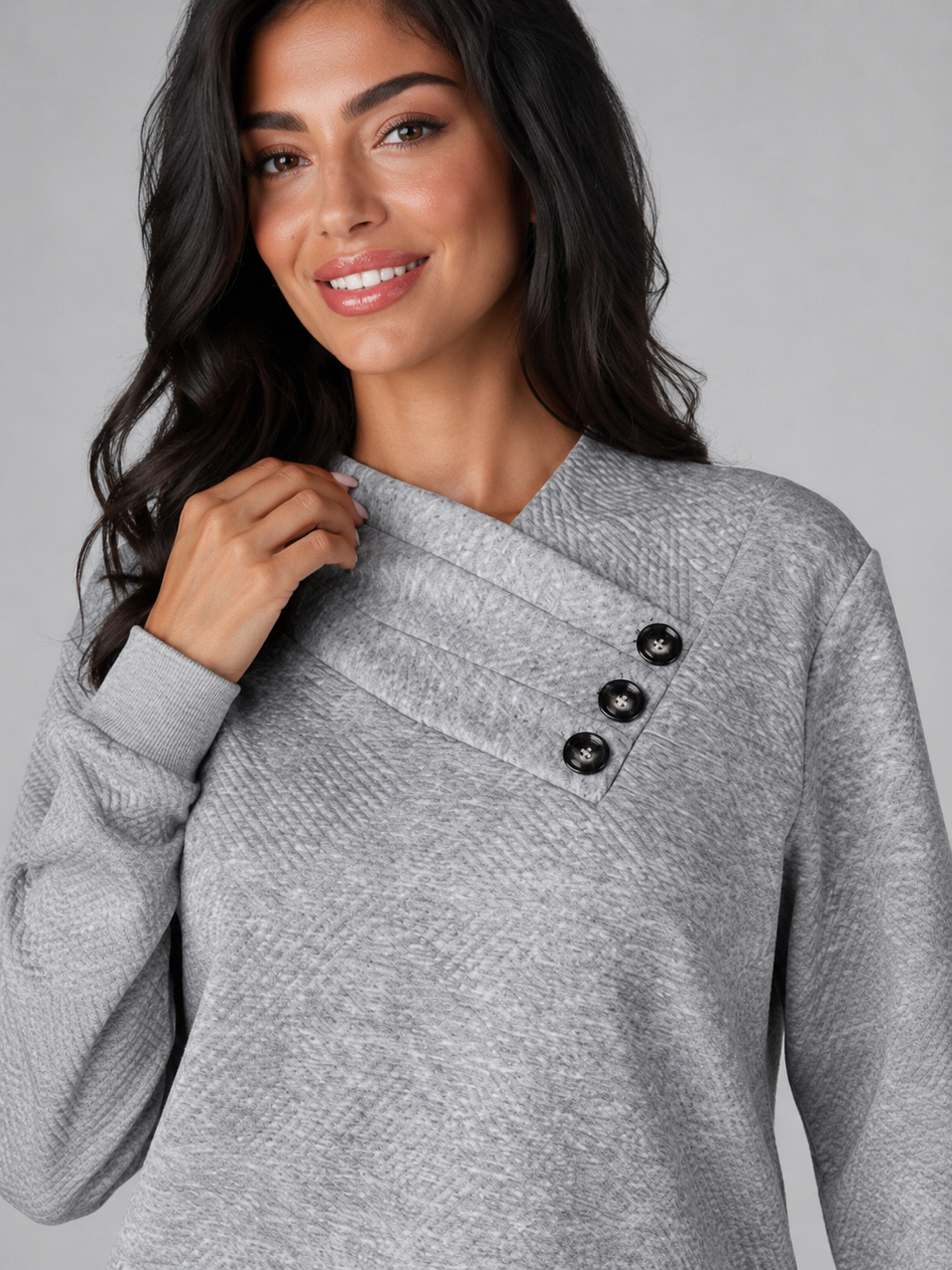 Women's sweater featuring an asymmetric shawl collar and stylish button detail, crafted from soft textured knit for ultimate comfort and warmth. 2