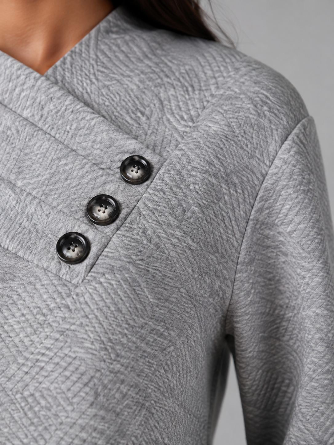 Women's sweater featuring an asymmetric shawl collar and stylish button detail, crafted from soft textured knit for ultimate comfort and warmth. 3