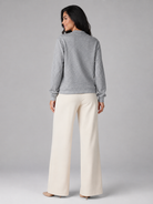 Women's sweater featuring an asymmetric shawl collar and stylish button detail, crafted from soft textured knit for ultimate comfort and warmth. 6