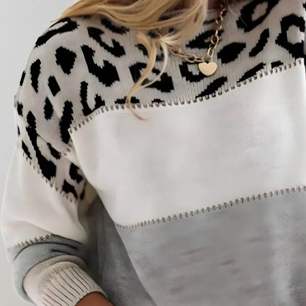 Women's soft knit sweater featuring a trendy color block design and stylish leopard print, perfect for casual everyday wear. 1