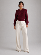 Women's sweater featuring stylish lantern sleeves, a cozy cable knit design, and a comfortable crew neck, available in five vibrant colors. 4