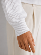 Women's sweater featuring stylish lantern sleeves, a cozy cable knit design, and a comfortable crew neck, available in five vibrant colors. 7