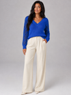 Women's sweater featuring open mesh sleeves and a stylish V-neck design, made from soft brushed knit for a relaxed fit, perfect for casual or layered outfits. 1