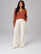 Women's sweater featuring open mesh sleeves and a stylish V-neck design, made from soft brushed knit for a relaxed fit, perfect for casual or layered outfits. 2
