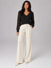 Women's sweater featuring open mesh sleeves and a stylish V-neck design, made from soft brushed knit for a relaxed fit, perfect for casual or layered outfits. 3