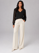 Women's sweater featuring open mesh sleeves and a stylish V-neck design, made from soft brushed knit for a relaxed fit, perfect for casual or layered outfits. 3