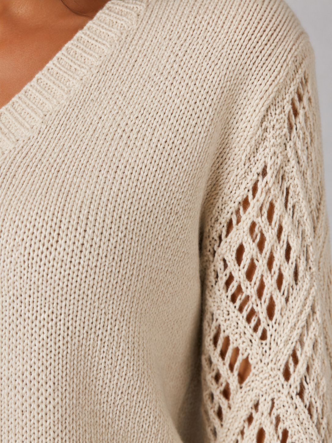 Women's sweater featuring open mesh sleeves and a stylish V-neck design, made from soft brushed knit for a relaxed fit, perfect for casual or layered outfits. 4