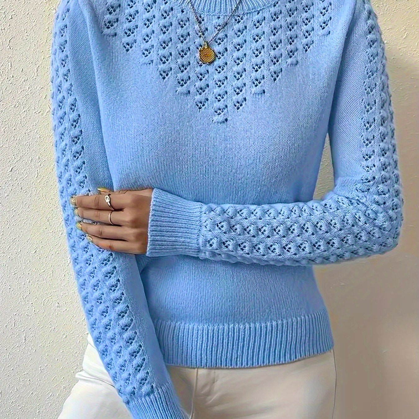 Women's fitted crew neck sweater featuring pointelle knit detail, available in blue, light yellow, and deep red, perfect for stylish winter layering. 0