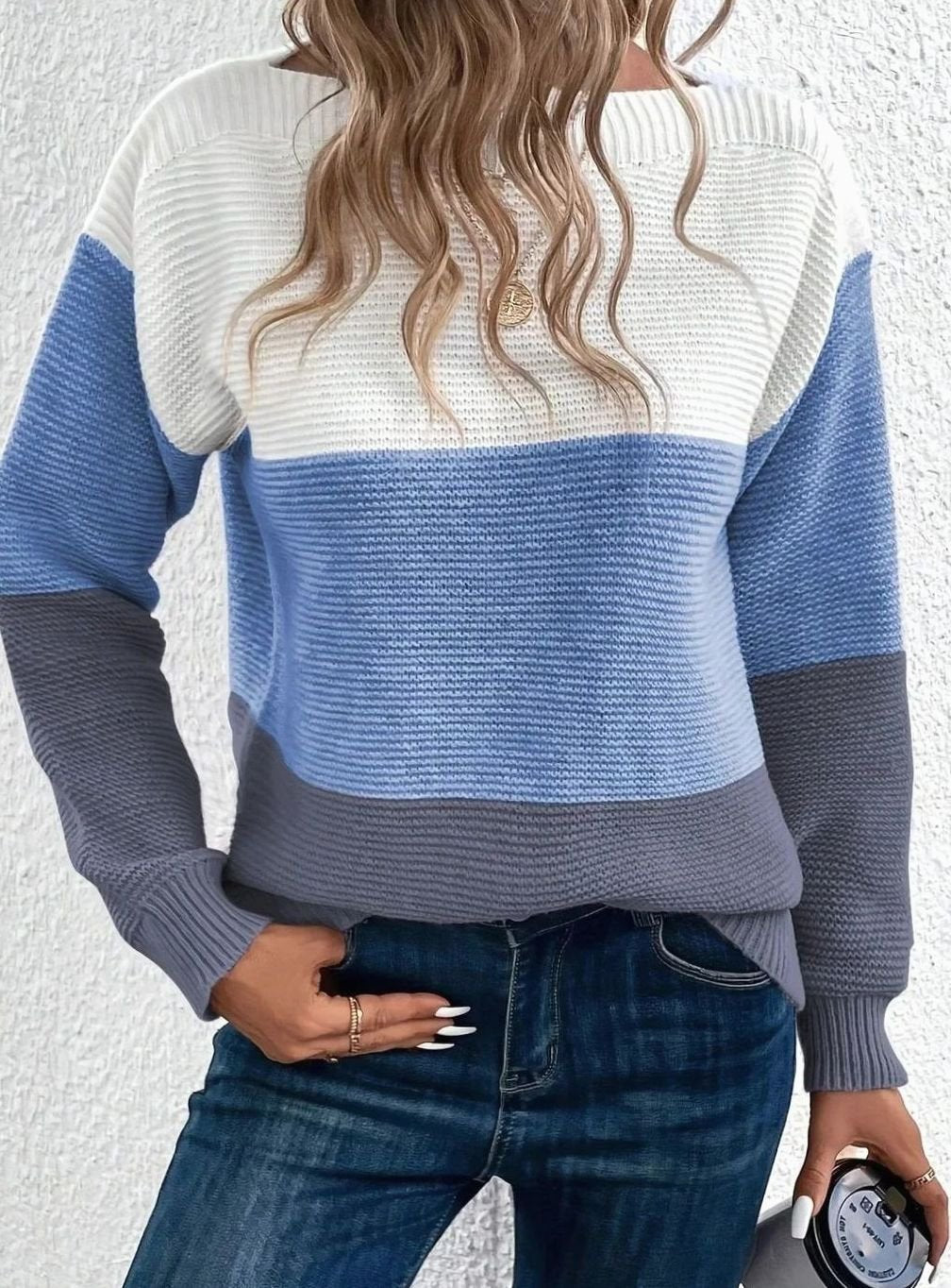 Women's sweater featuring a relaxed fit and boat neckline, designed with a soft color block ribbed knit pattern in pastel shades. 1