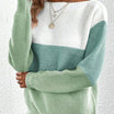 Women's sweater featuring a relaxed fit and boat neckline, designed with a soft color block ribbed knit pattern in pastel shades. 2