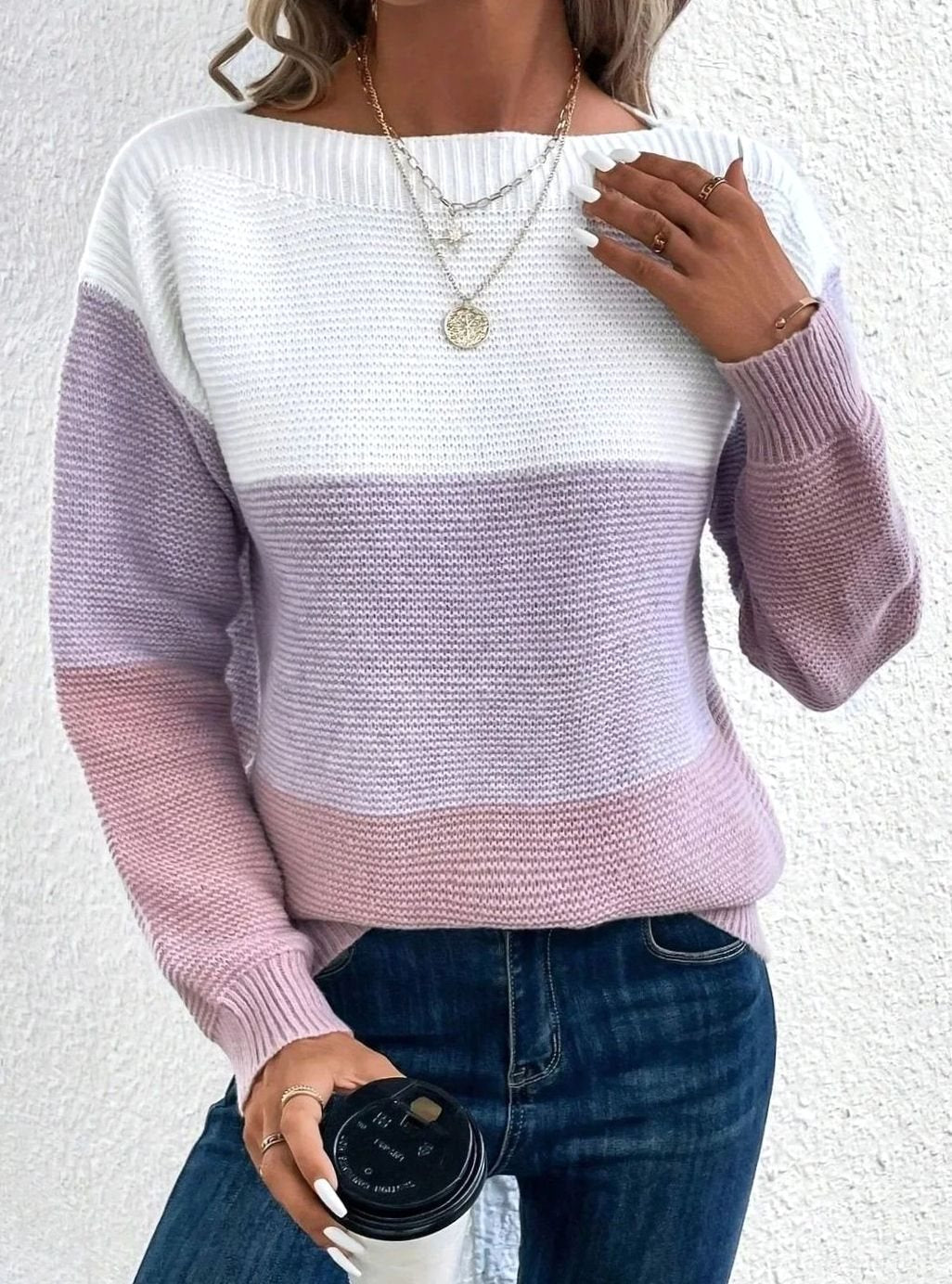 Women's sweater featuring a relaxed fit and boat neckline, designed with a soft color block ribbed knit pattern in pastel shades. 6