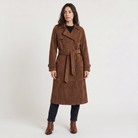Women's trench coat featuring an adjustable belt, classic lapel collar, and a slim fit longline design in soft faux suede. 0