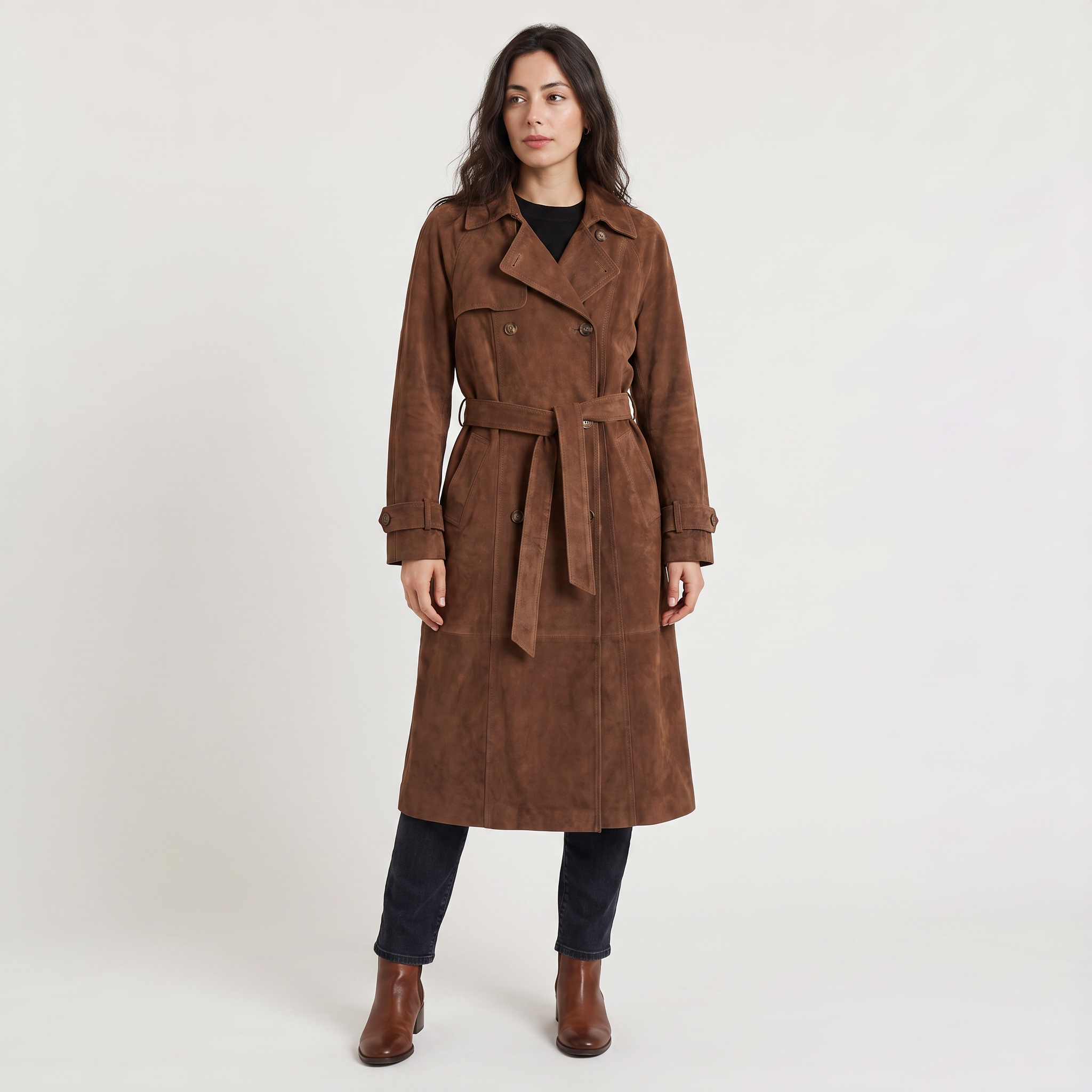 Women's trench coat featuring an adjustable belt, classic lapel collar, and a slim fit longline design in soft faux suede. 0