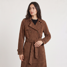Women's trench coat featuring an adjustable belt, classic lapel collar, and a slim fit longline design in soft faux suede. 2