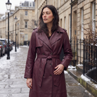 Women's brown faux leather trench coat with belt and satin lining, featuring a stylish midi length and elegant design. 2