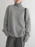 Women's turtleneck sweater featuring a chunky knit design, made from 100% wool, perfect for cozy warmth in fall and winter, with long sleeves 3