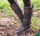 Women's waterproof knee high boots in black vegan leather featuring double buckle straps and an easy pull-on design, perfect for stylish and practical footwear in wet weather. 0