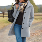 Women's winter coat featuring a stylish button placket, designed in a classic long fit that exudes timeless elegance and warmth for cold weather. 5