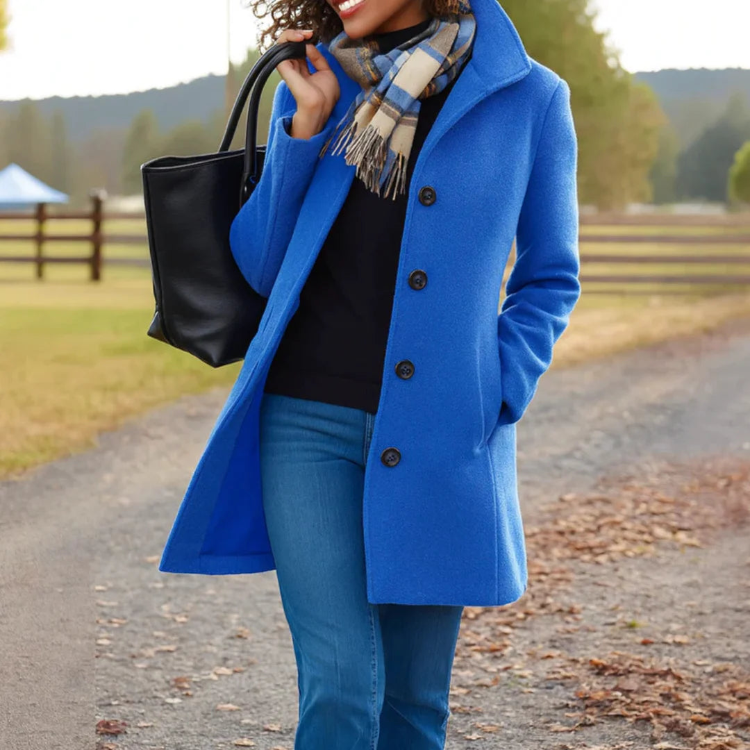 Women's winter coat featuring a stylish button placket, designed in a classic long fit that exudes timeless elegance and warmth for cold weather. 7