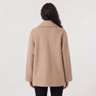 Women’s oversized wool blend coat featuring front button fastening, perfect for winter fashion and warmth. 5