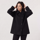 Women’s oversized wool blend coat featuring front button fastening, perfect for winter fashion and warmth. 8