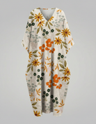 Womens floral linen midi dress featuring a V-neck and short sleeves, perfect for summer casual wear. 5