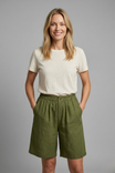 Womens linen shorts featuring an elastic waist and side pockets, designed for a relaxed fit perfect for warm weather. 0