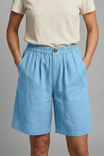 Womens linen shorts featuring an elastic waist and side pockets, designed for a relaxed fit perfect for warm weather. 8