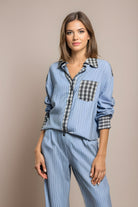 Womens pyjamas set featuring a relaxed fit, made from soft breathable fabric, with full-length trousers available in pink or blue. 0