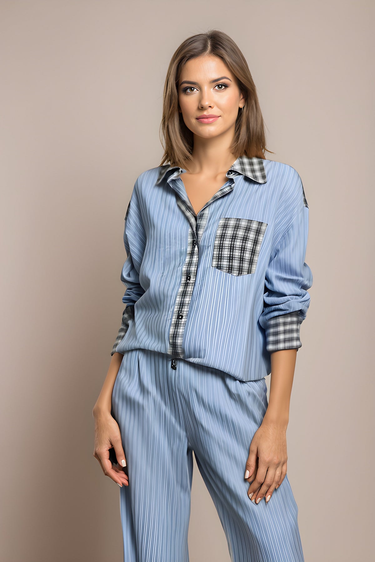 Womens pyjamas set featuring a relaxed fit, made from soft breathable fabric, with full-length trousers available in pink or blue. 0