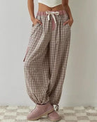 Womens pyjamas set featuring a relaxed fit, made from soft breathable fabric, with full-length trousers available in pink or blue. 4