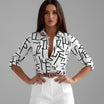 Womens lightweight printed blouse featuring a classic collar and roll-up sleeves, designed for a relaxed fit ideal for casual or semi-formal occasions. 0