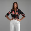 Womens lightweight printed blouse featuring a classic collar and roll-up sleeves, designed for a relaxed fit ideal for casual or semi-formal occasions. 3