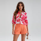 Womens lightweight printed blouse featuring a classic collar and roll-up sleeves, designed for a relaxed fit ideal for casual or semi-formal occasions. 4
