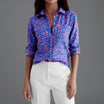Womens lightweight printed blouse featuring a classic collar and roll-up sleeves, designed for a relaxed fit ideal for casual or semi-formal occasions. 7