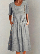 Womens summer dress featuring a striped design, midi length, and breathable fabric for an elegant and comfortable fit. 2