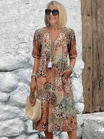 Womens summer dress featuring a V-neck design and a vibrant floral pattern, knee-length, made from soft fabric, and includes convenient side pockets. 4
